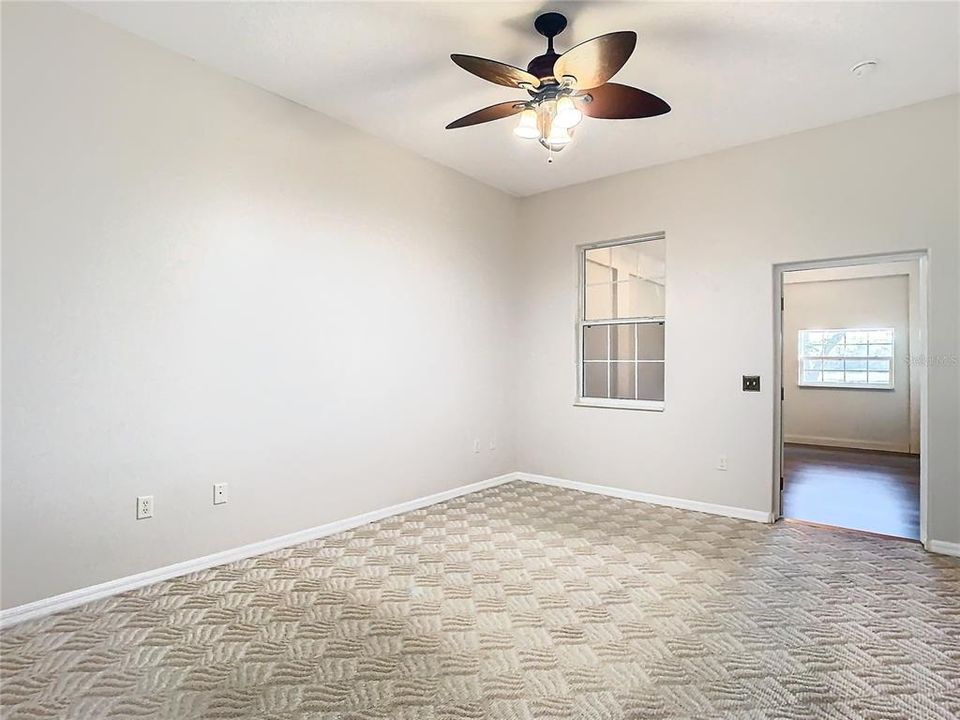 Primary bedroom overlooking bonus room