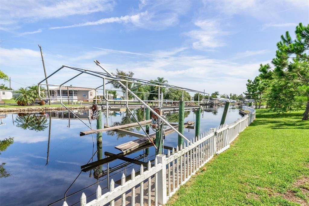 Fully-fenced yard and over 200 feet of waterfront (boat lift is not operational).