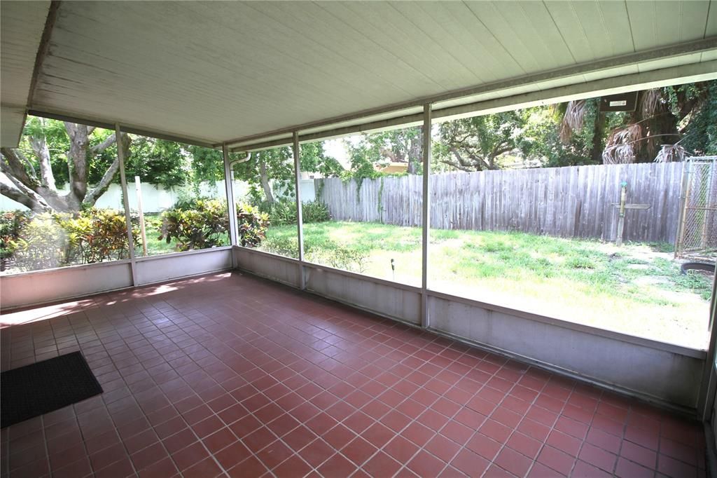 Spacious Screened Porch with Tile Floor