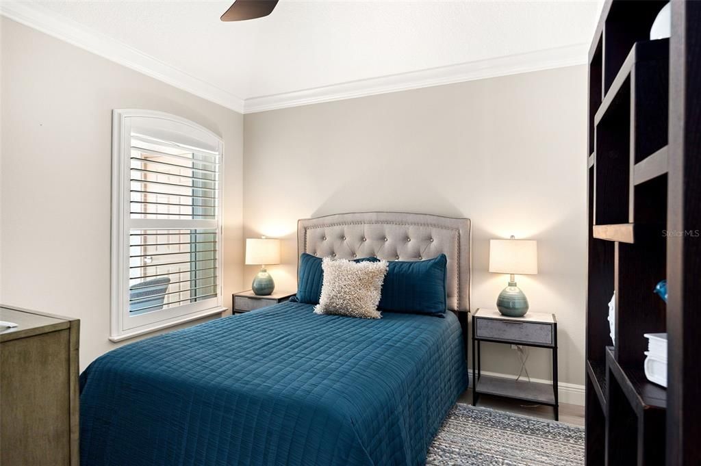 Guests will feel right at home in the spacious guest bedroom, complete with a double-door closet for ample storage.