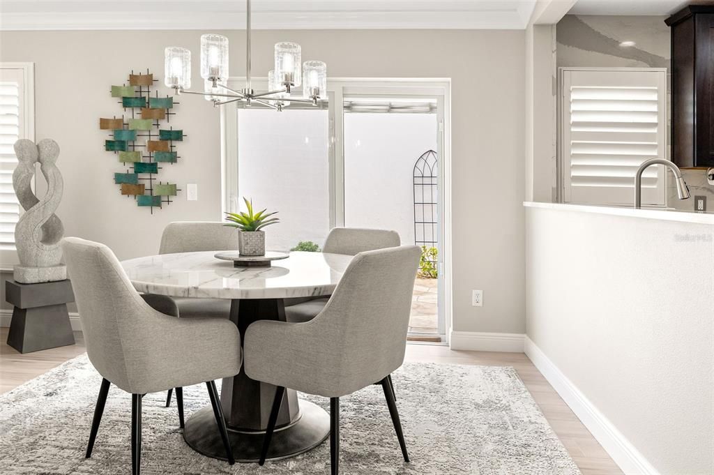 The dining room, adorned with crown molding, offers the perfect space for entertaining.