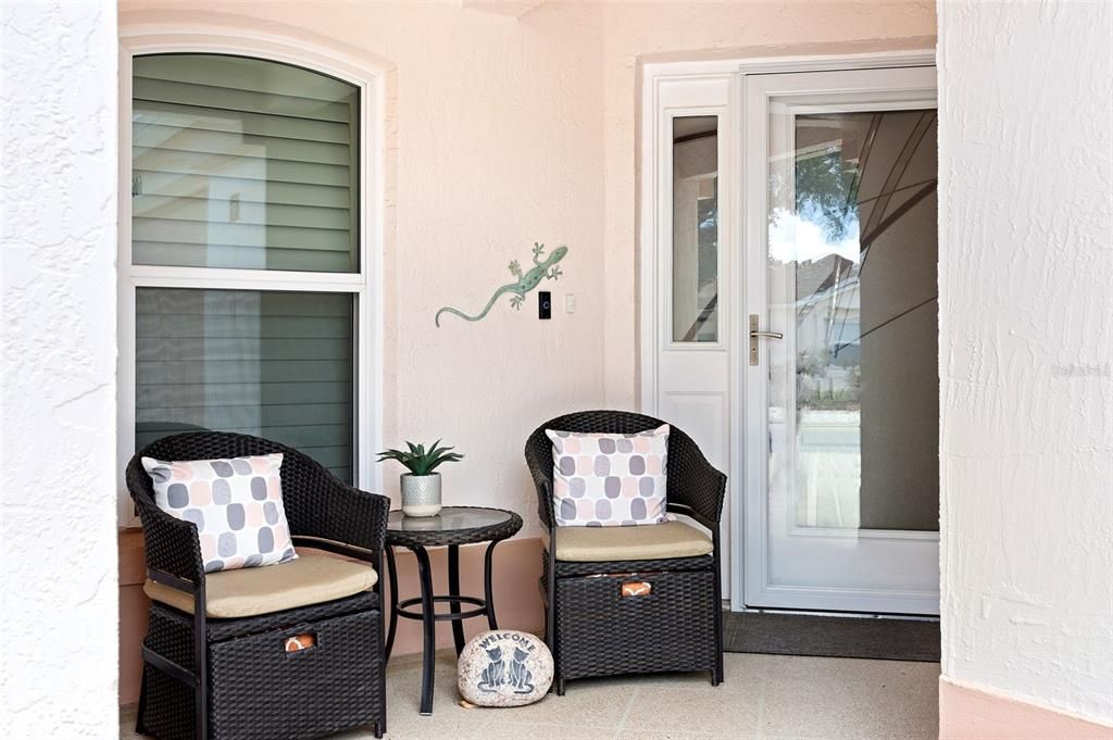 Front seating area as you enter the front door with glass storm door.