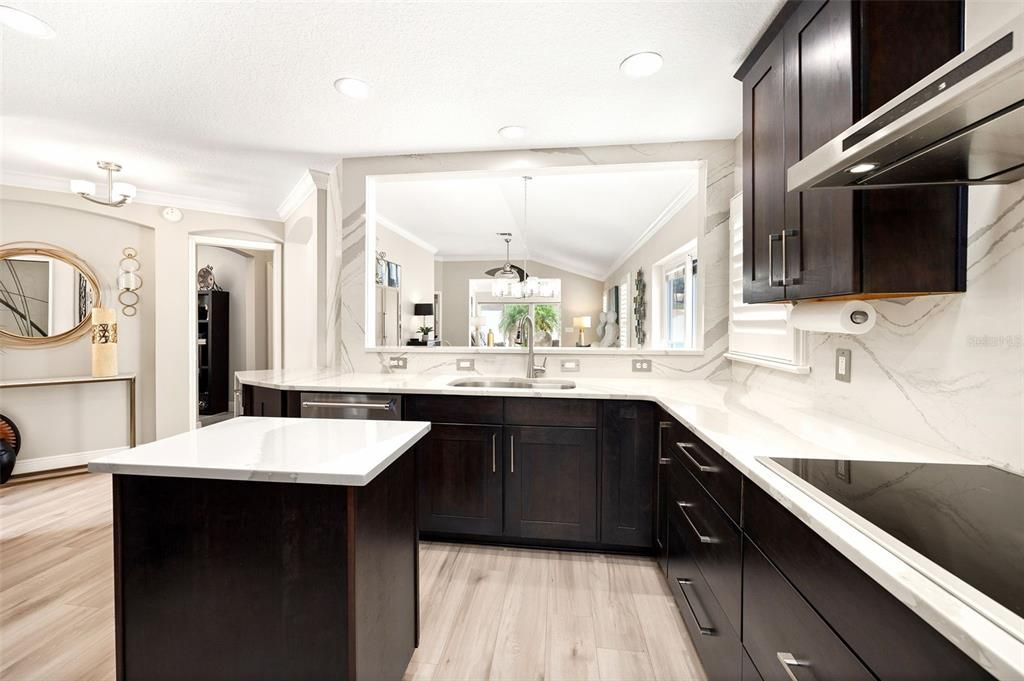 Natural light flows through this space with its solar tube and open space leading into the dining room.