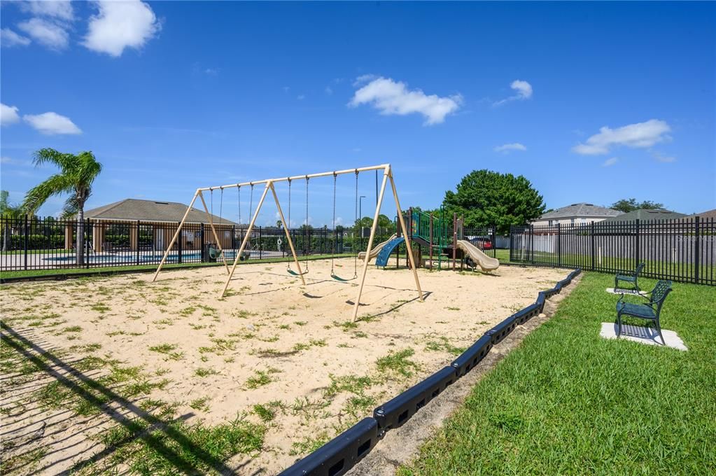 Larger view of Community Playground area with view of Pool and Clubhouse