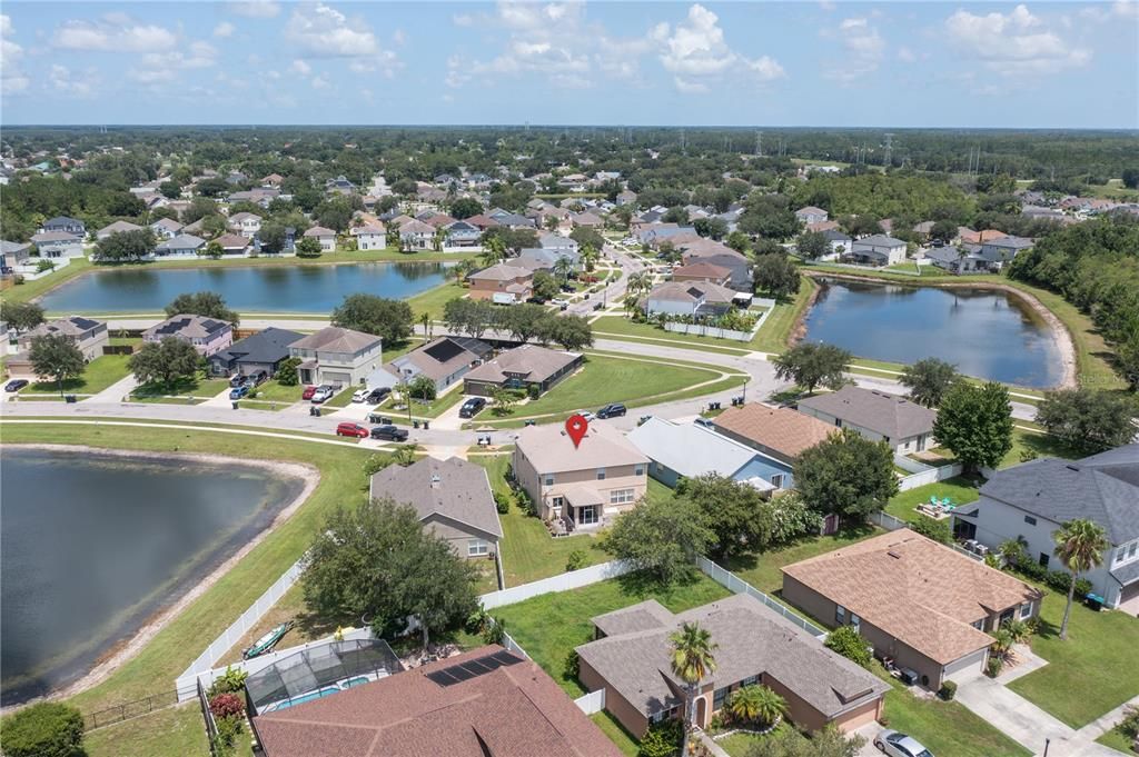 Aerial view of property  and nearby community homes