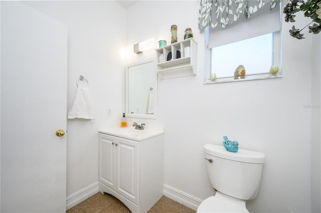 Updated half bath down, next to kitchen, laundry and garage area.