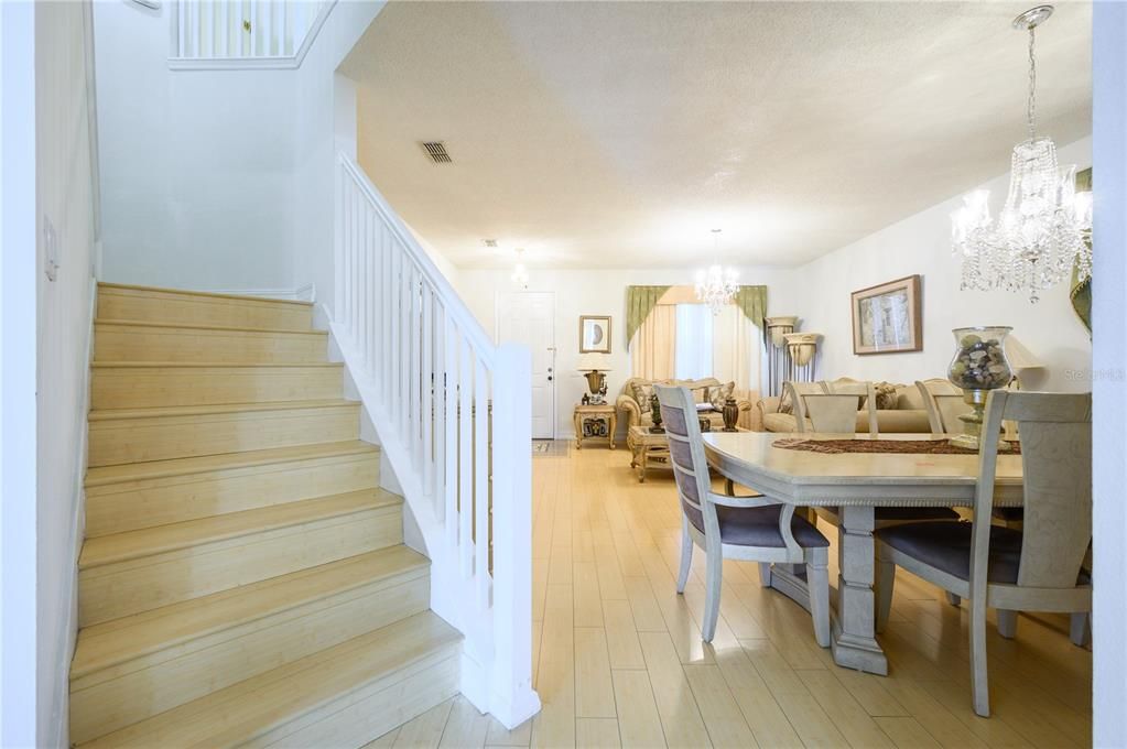 Closeup Staircase  and view to Liv-Din area.  Note beautiful Bamboo tile  flooring.