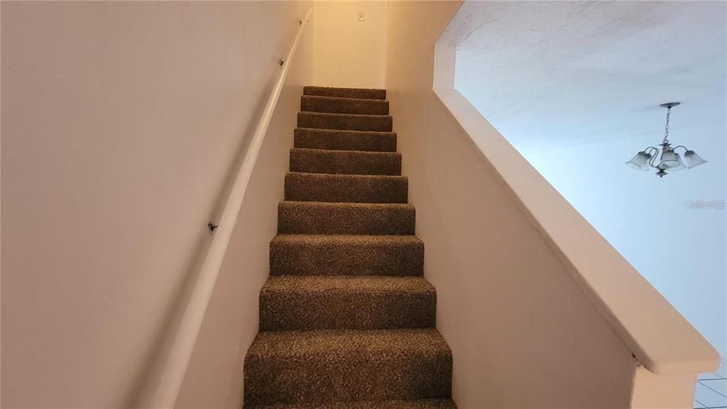 STAIRS TO TWO BEDROOMS.