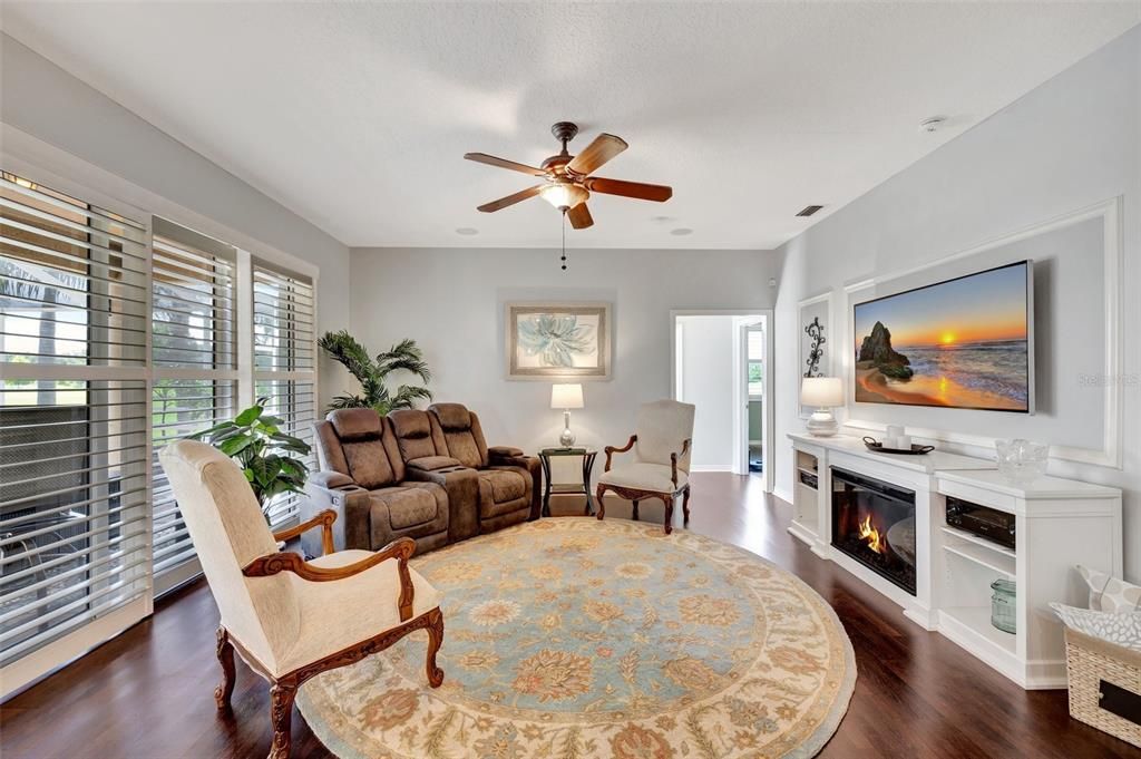 Laminate wood floors, ceiling fan and built in speakers are a wonderful addition to this casual space