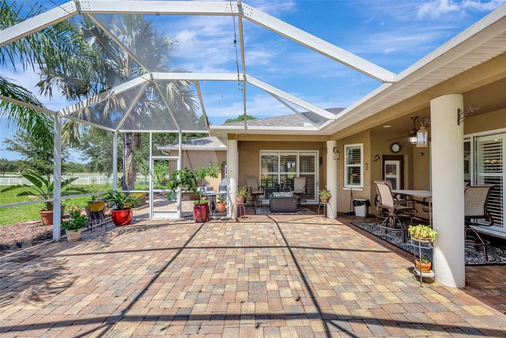 Screened patio surrounded by luxurious landscaping and the peaceful sounds of nature