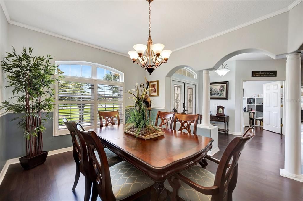 Formal dining room with warm colors and lots of natural light