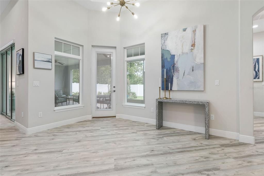 Kitchen nook with door leading out to screened lanai