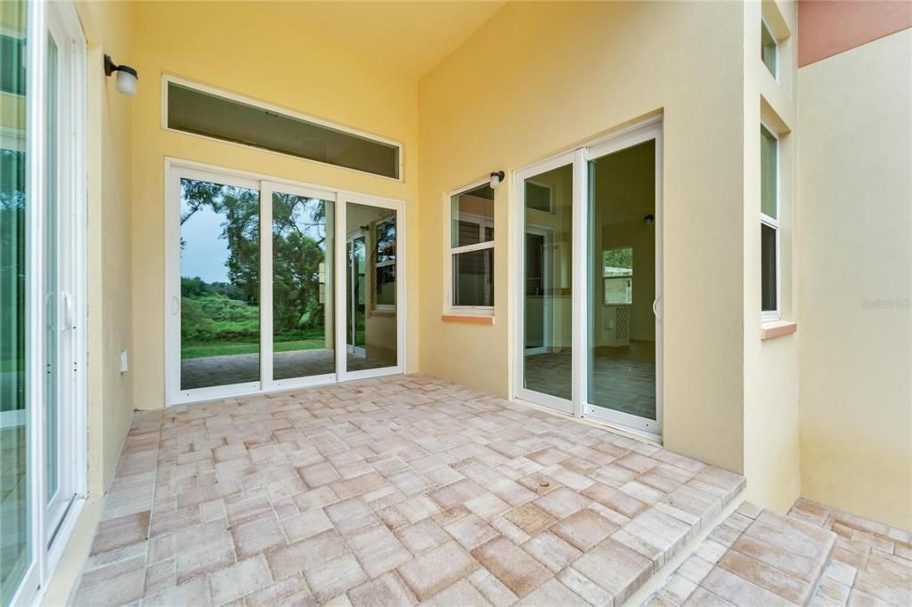 Covered patio joining the kitchen - family - living room and primary suite