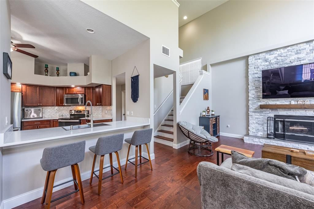 Breakfast bar provides extra seating and seamlessly connects with the family room.