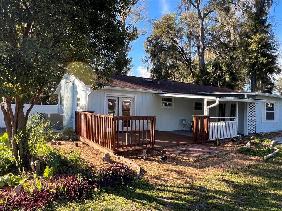 Brand New Wooden Deck just outside the Master Bedroom connected to a covered Lanai