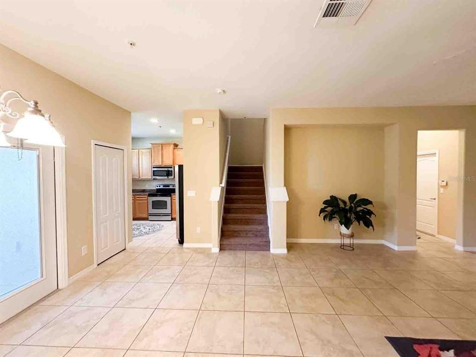 Dining Area looking into Kitchen and Stairway to