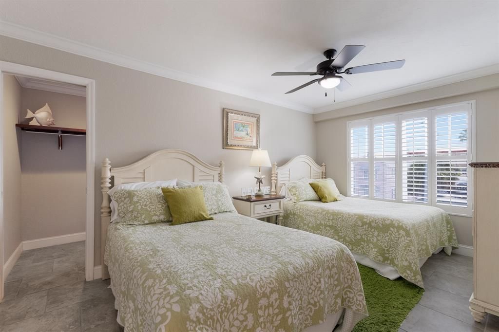 bedroom #2 - walk in closet, impact window, crown molding