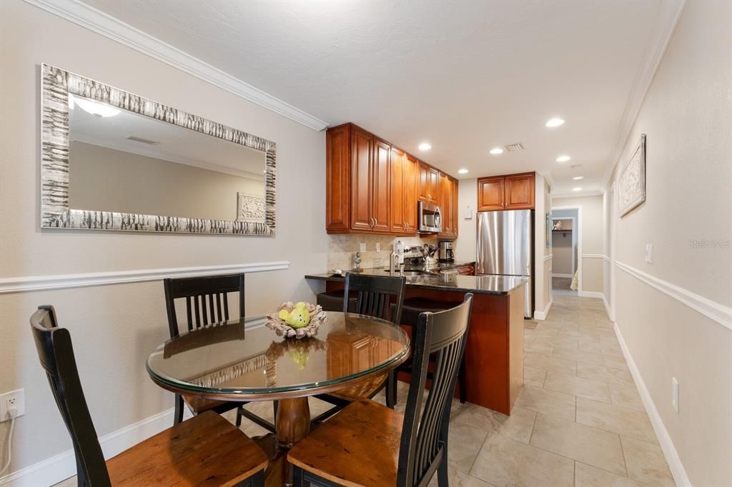 Dining room is open to the kitchen and additional counter seating