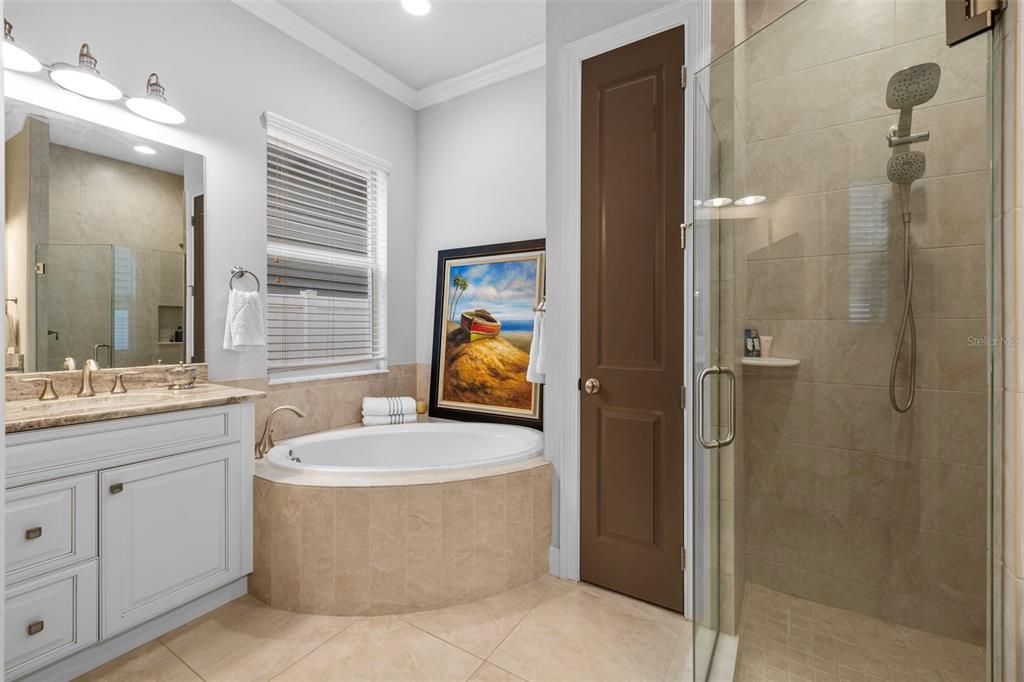 primary en suite with soaker tub, linen closet & separate shower