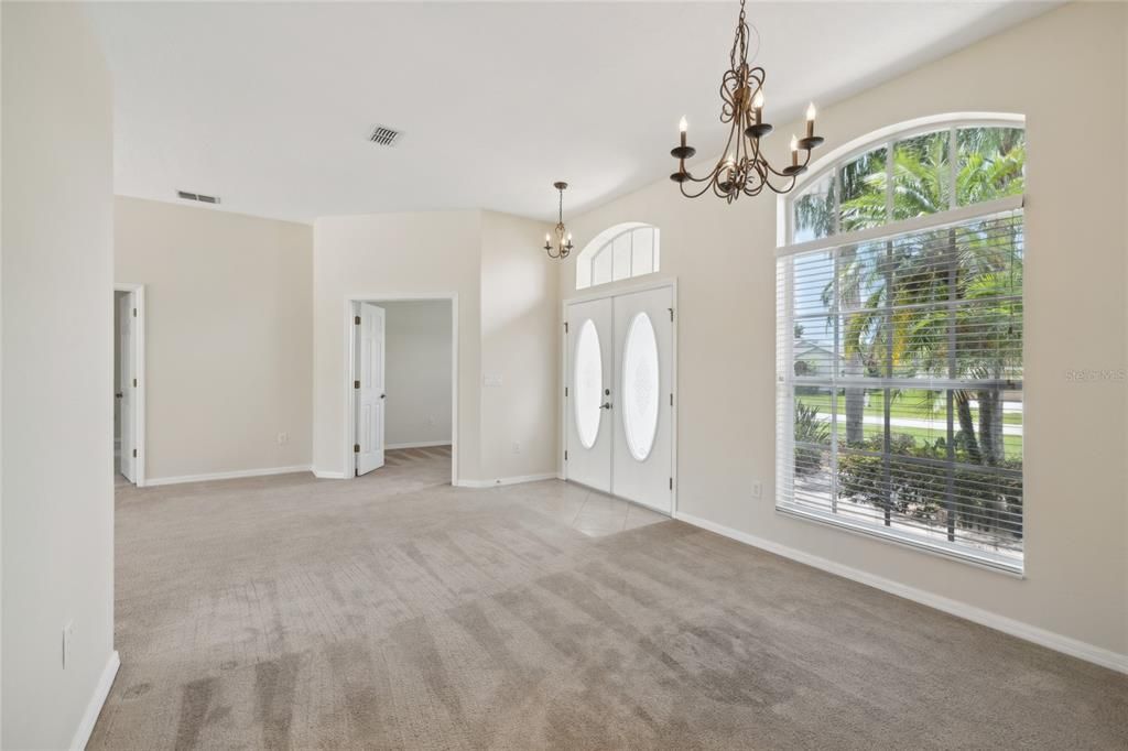 Entryway, dining room, and doors to office