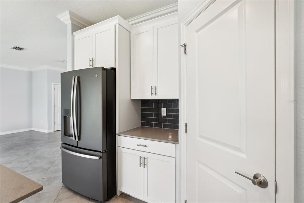 The Kitchen has STONE COUNTERTOPS, an OVERSIZED ISLAND, STAINLESS STEEL APPLIANCES, UPGRADED CABINETRY and BEAUTIFUL TILE BACKSPLASH.