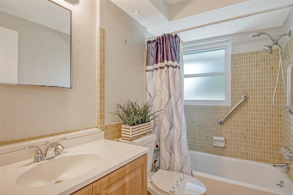 Guest bathroom with tub shower combo