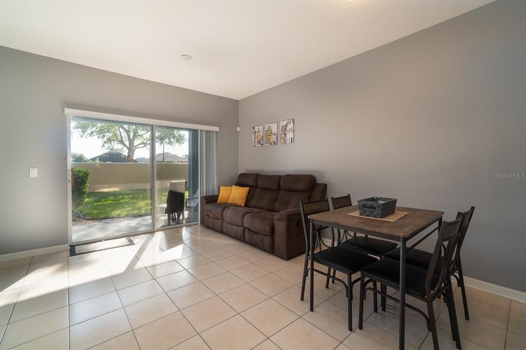 spacious living area that has glass sliding door going to the lanai