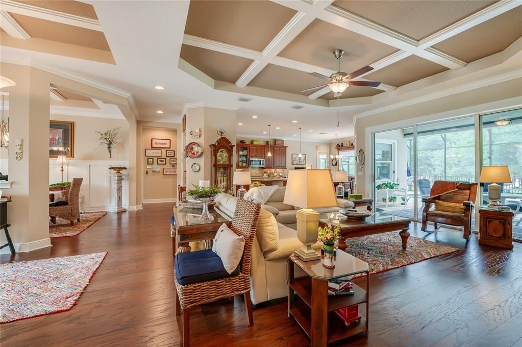 Great room with dining room to the left and pool to the right