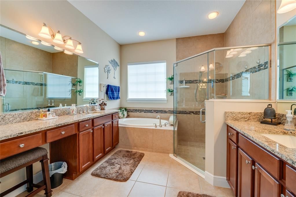 Large primary bathroom with soaking tub and separate shower