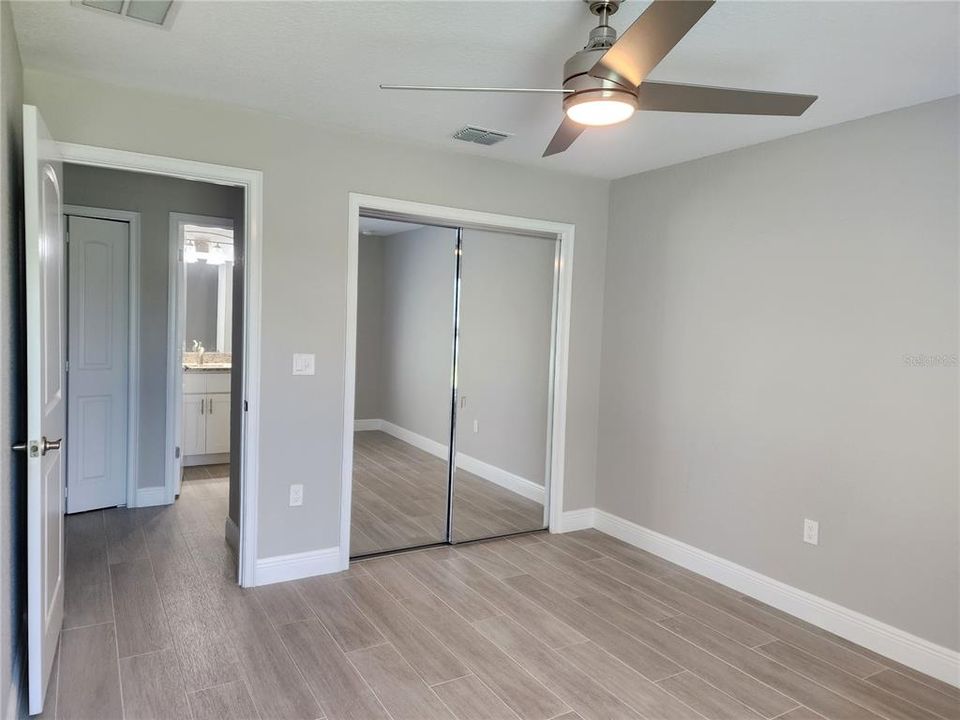 Bedroom 3 with mirrored closet doors