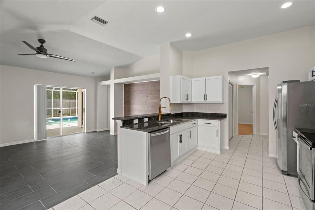 Complete Kitchen Remodel and Update  with Granite Countertops, Brand New Stainless Steel Appliances, High End Fixtures, New Garbage Disposal.