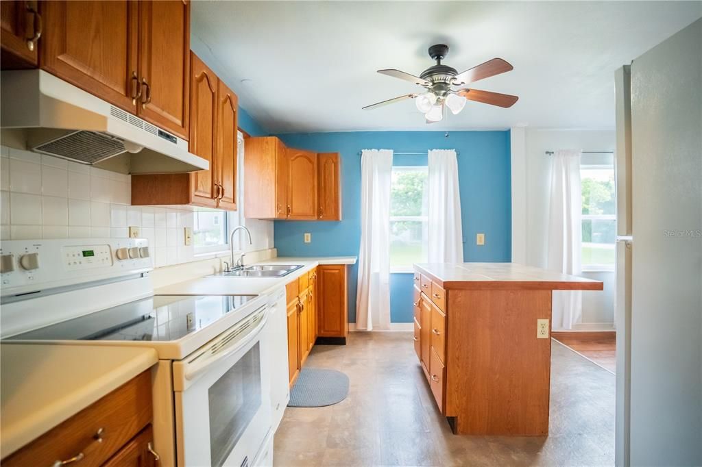 Tons of storage in this kitchen including a lazy Susan in the corner cabinet.