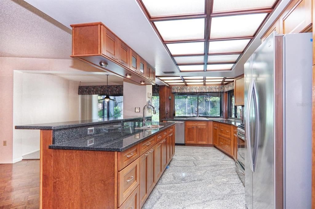 Kitchen has granite flooring and counter tops.