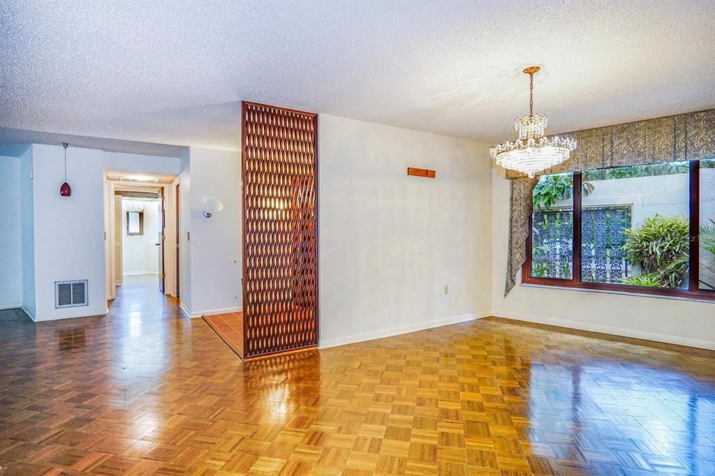 Formal dining room with beautiful hard wood, parquet flooring