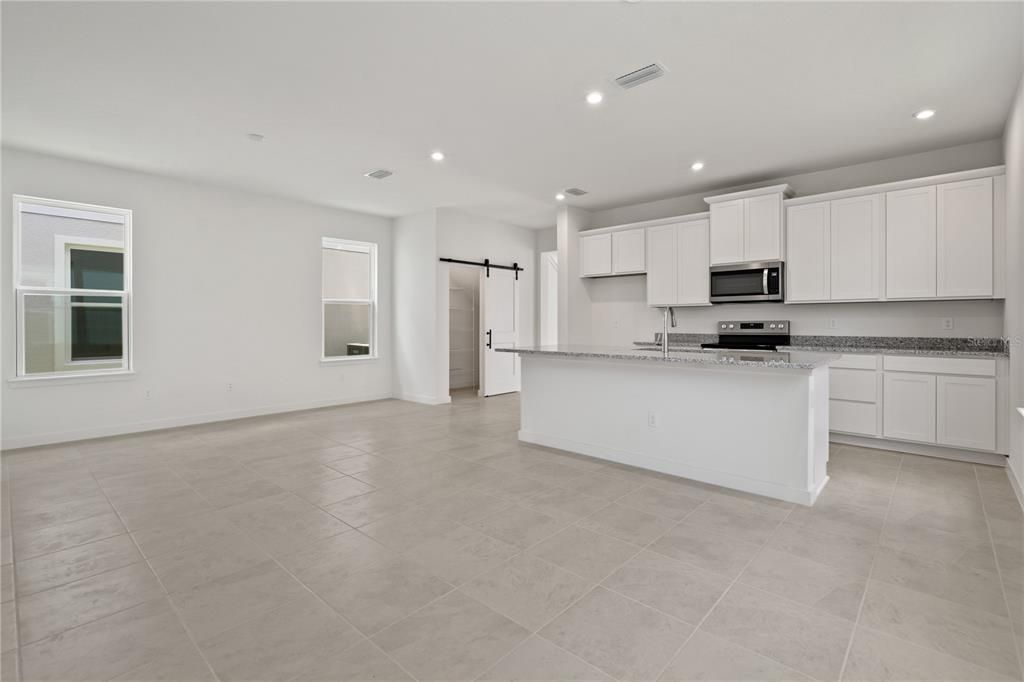 Spacious living room with eat-in kitchen.