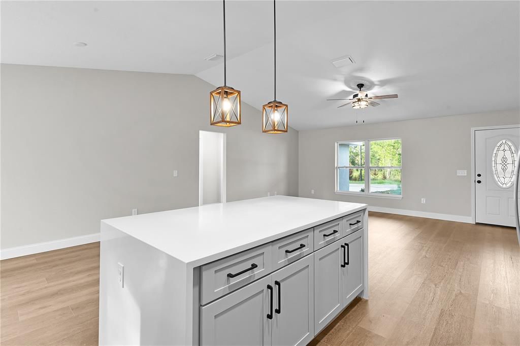 Looking at the living area across the kitchen island