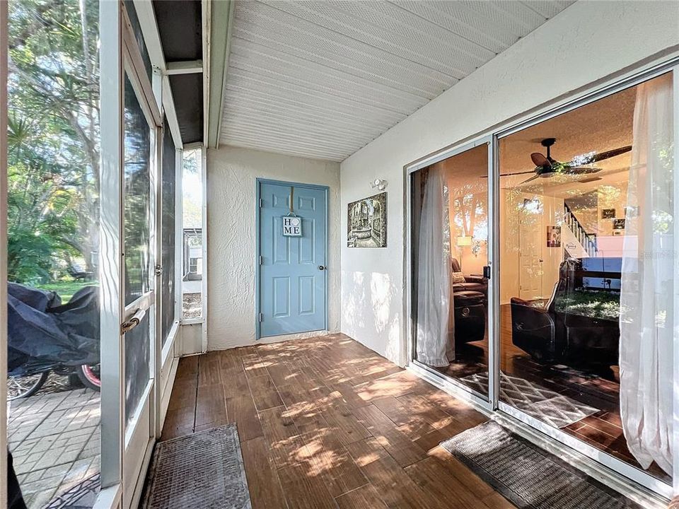 Downstairs screened enclosure with ADDITIONAL storage room.