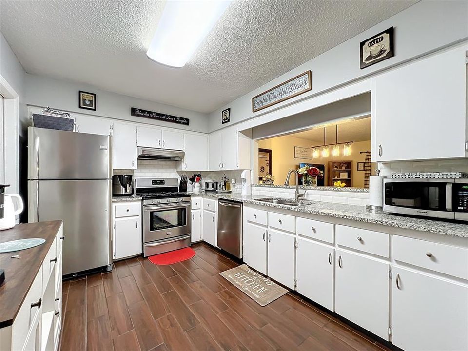 Stainless appliance package with granite countertops.