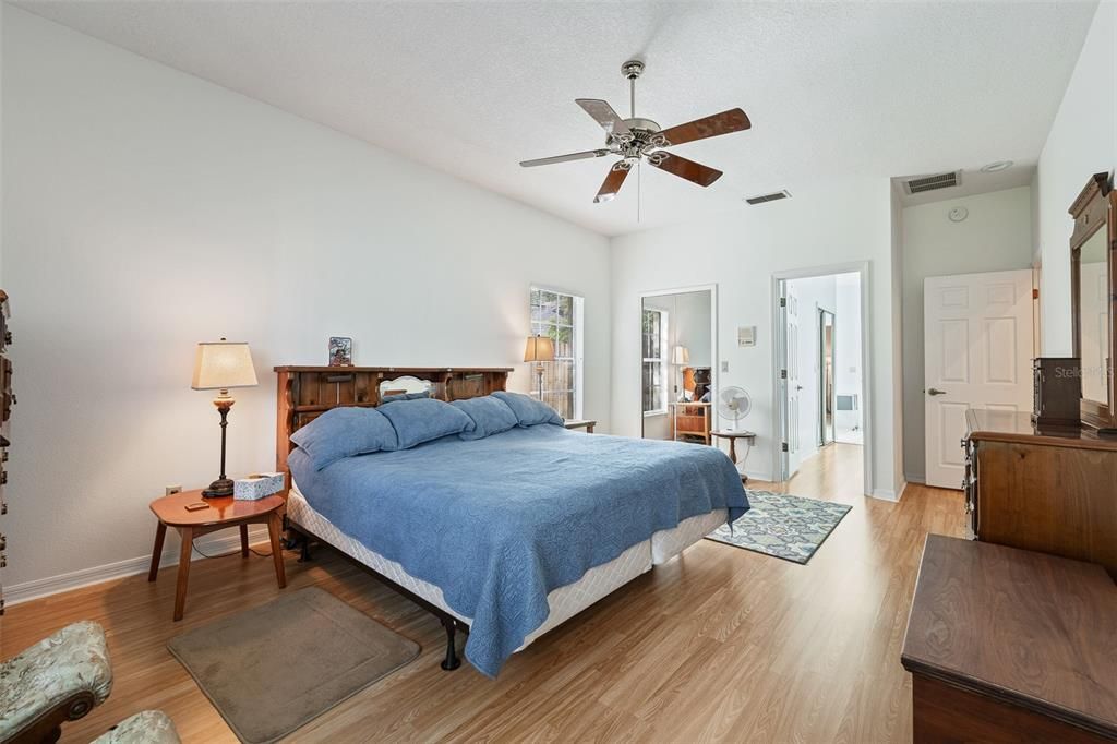 Primary bedroom with walk in closet and bathroom