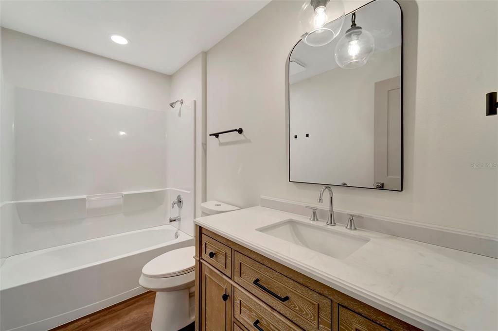 Bath Room 2 Shower with Tub Quartz Counter Top.