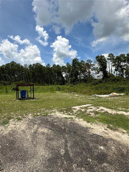 backside property view with well