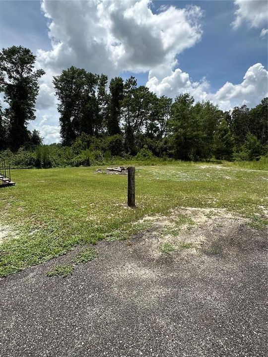 behind the home is a huge fire pit, great for get together with family and friends