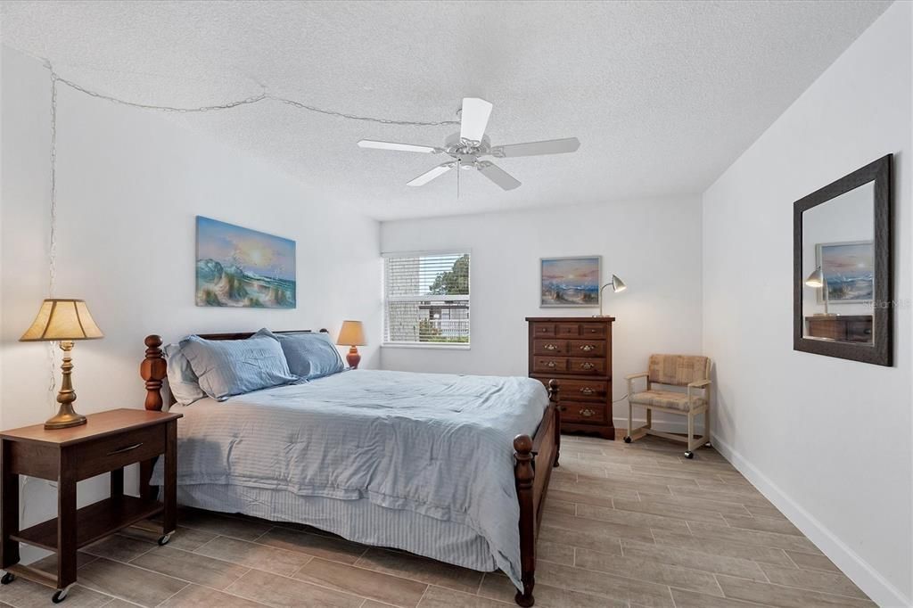 brand new ceramic plank tile flooring in bedroom