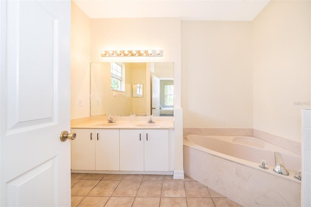 Full Ensuite Master Bath, with Stand-Up Shower, Garden Tub and Dual Vanity.