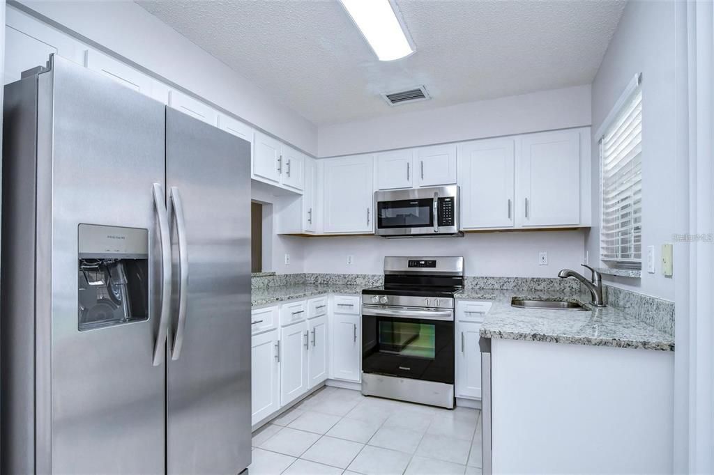 Kitchen w/ Brand New Stainless Steel Appliances