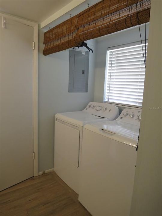 washer in dryer located in hall bath