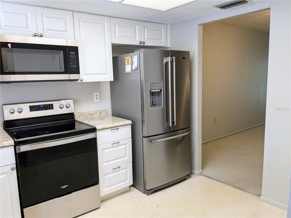 Kitchen and dining area beyond