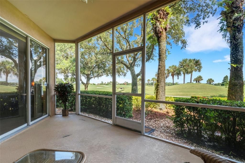 The covered screen enclosed lanai is a great place to relax.