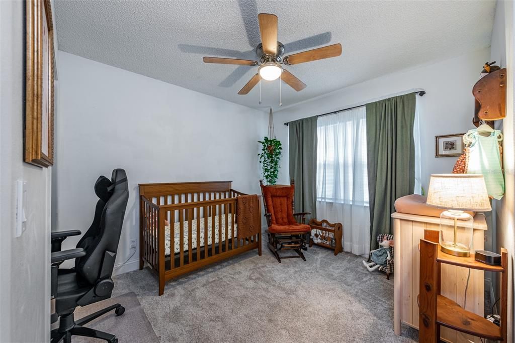 Secondary bedroom #3 is 11' x 10' with a built-in closet, carpet and ceiling fan.