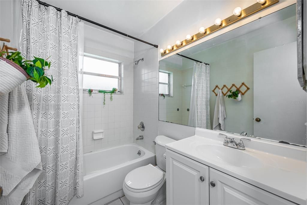 Full guest bathroom with Tub/Shower combination is centrally located between the 2 secondary bedrooms.